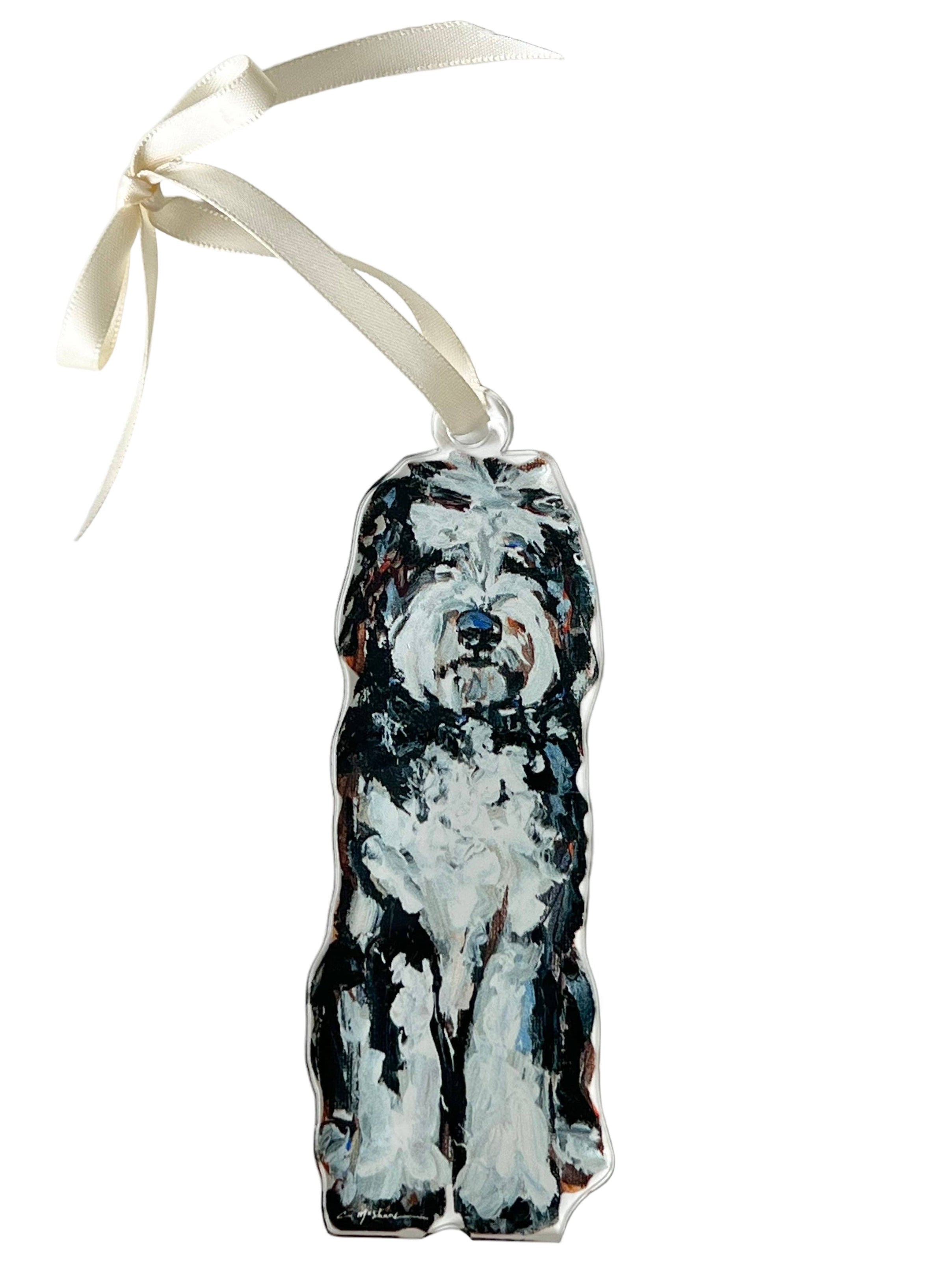 Dog-shaped ornament with a ribbon on a white background