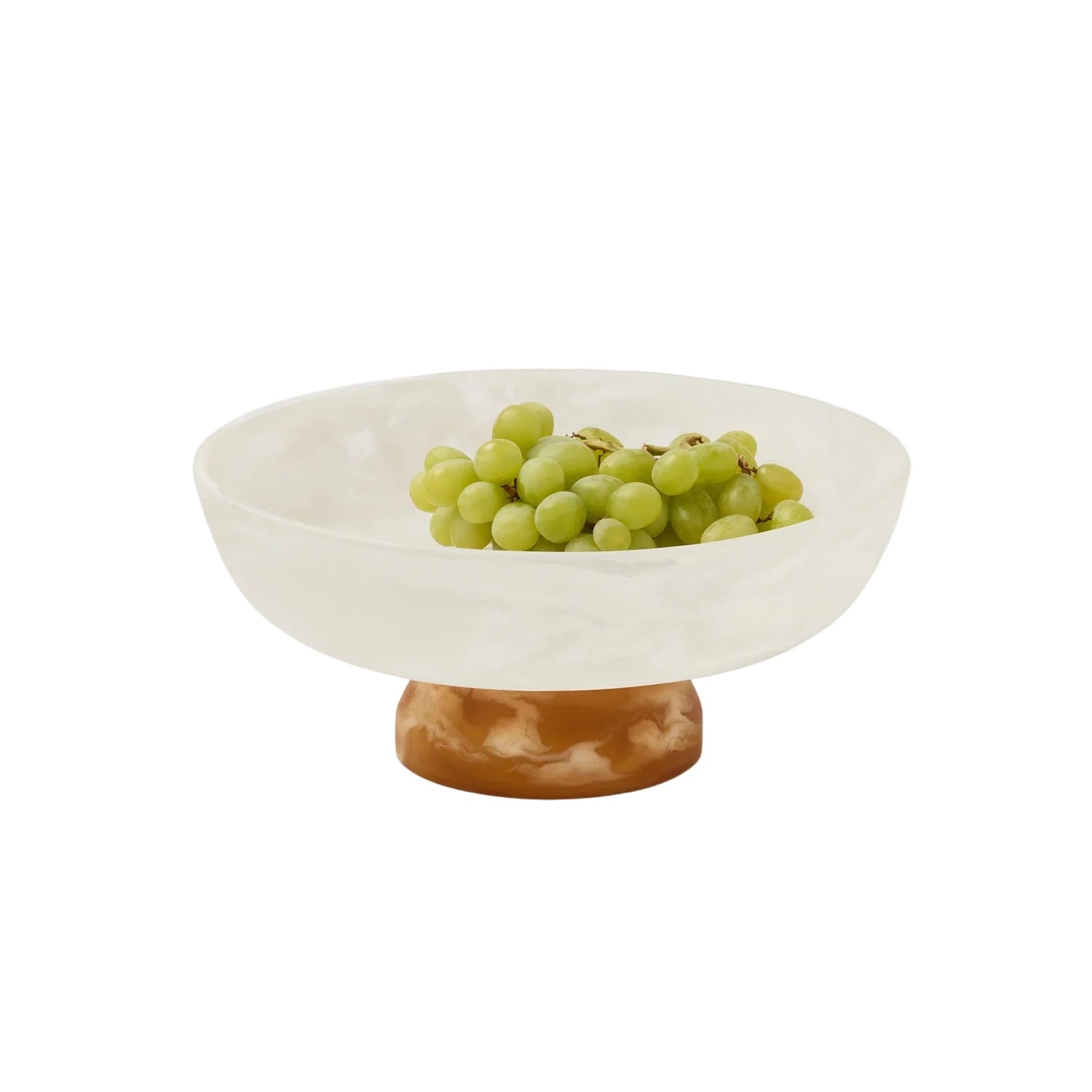 White bowl with a wooden base containing green grapes on a white background