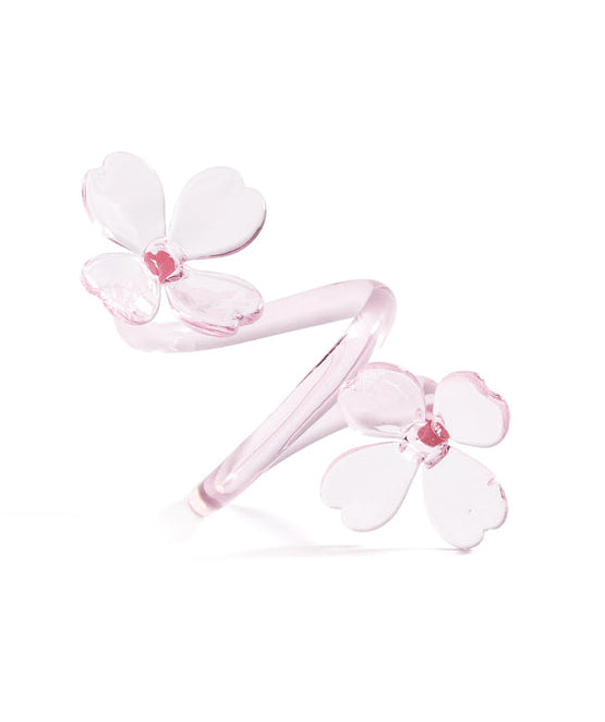 Pink hair tie with floral design on a white background