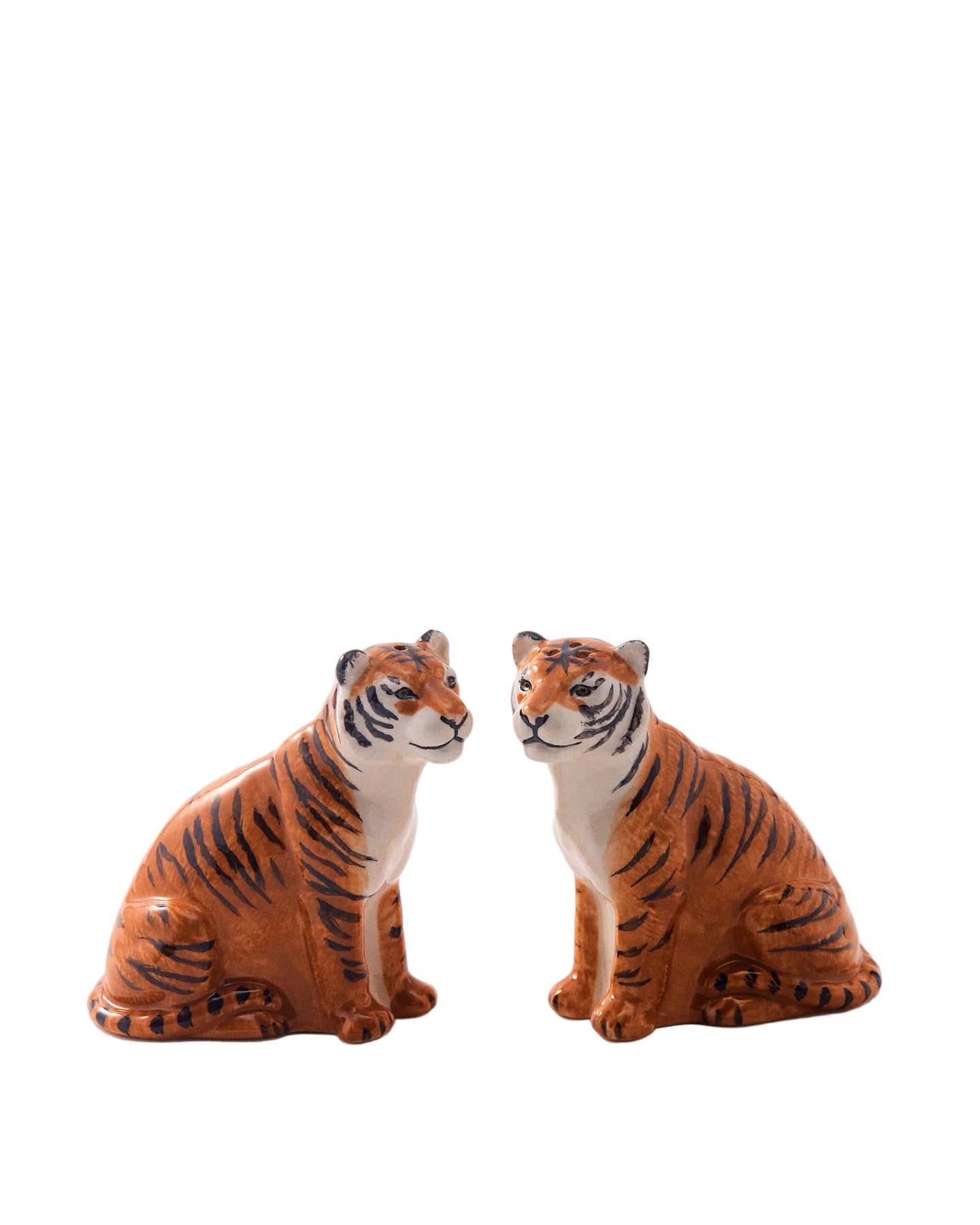 Two tiger figurines on a white background