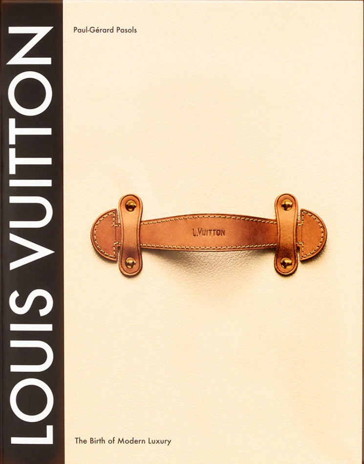 Book cover of 'Louis Vuitton: The Birth of Modern Luxury' with a Louis Vuitton bag on a beige background.
