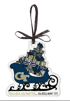Decorative Christmas ornament shaped like a sleigh with a bow on a gray background