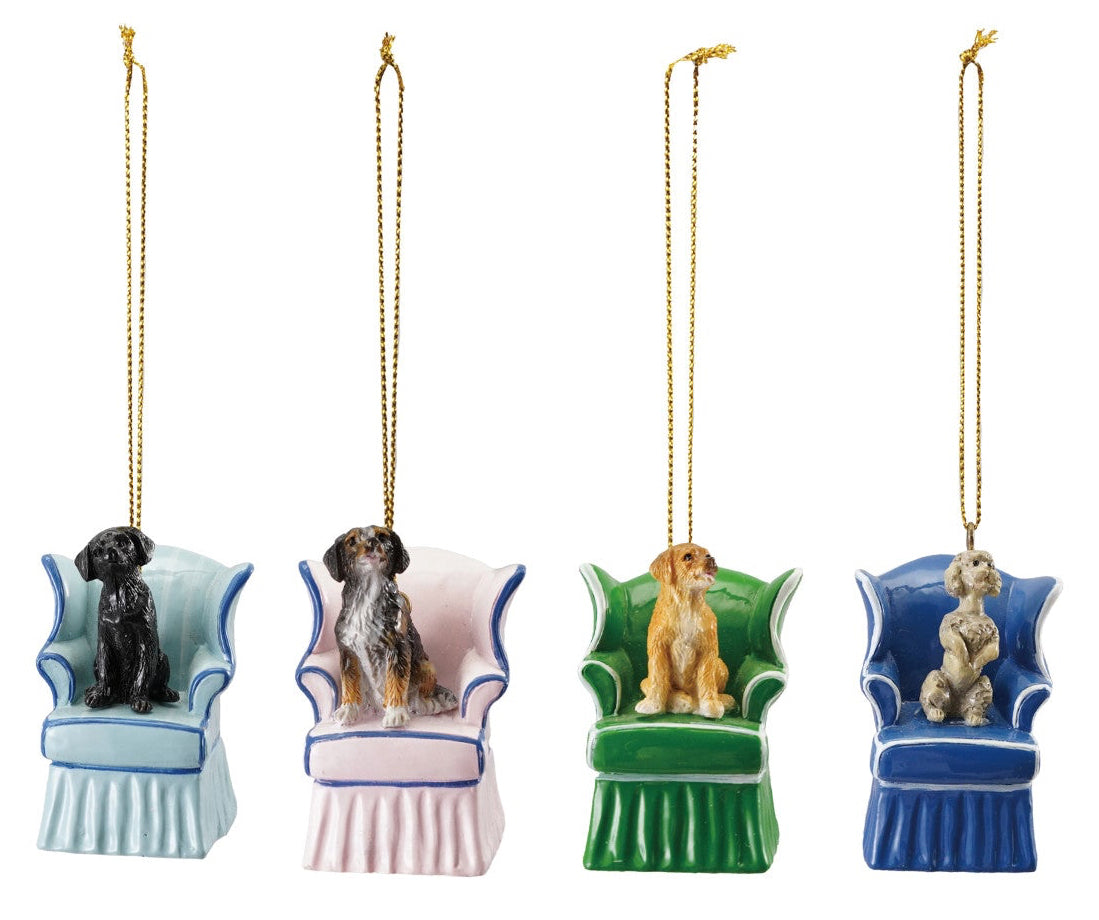 Four decorative dog ornaments on chairs with different breeds, each on a white background.