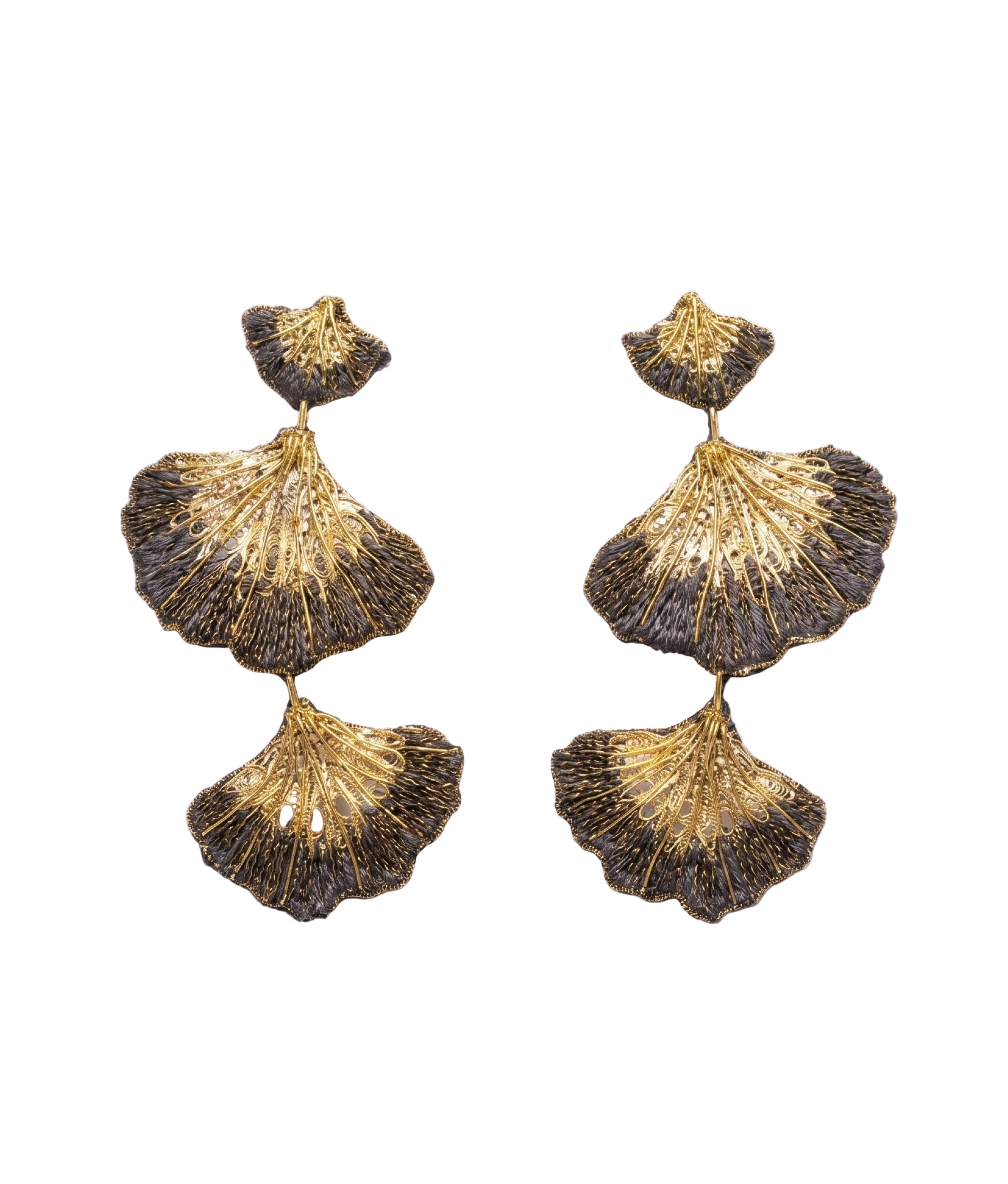 Pair of gold and bronze shell-shaped earrings on a white background