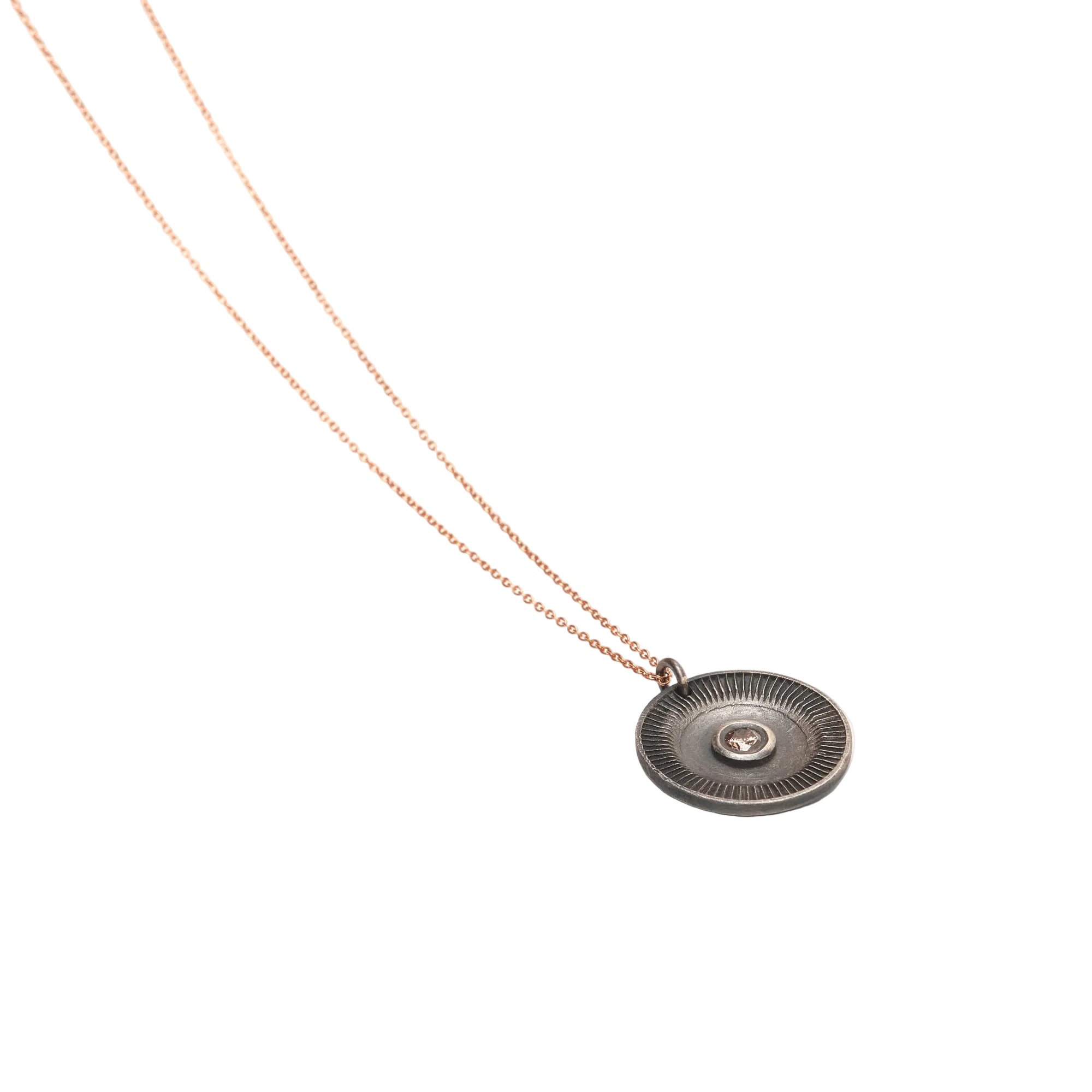 Necklace with a round pendant on a white background