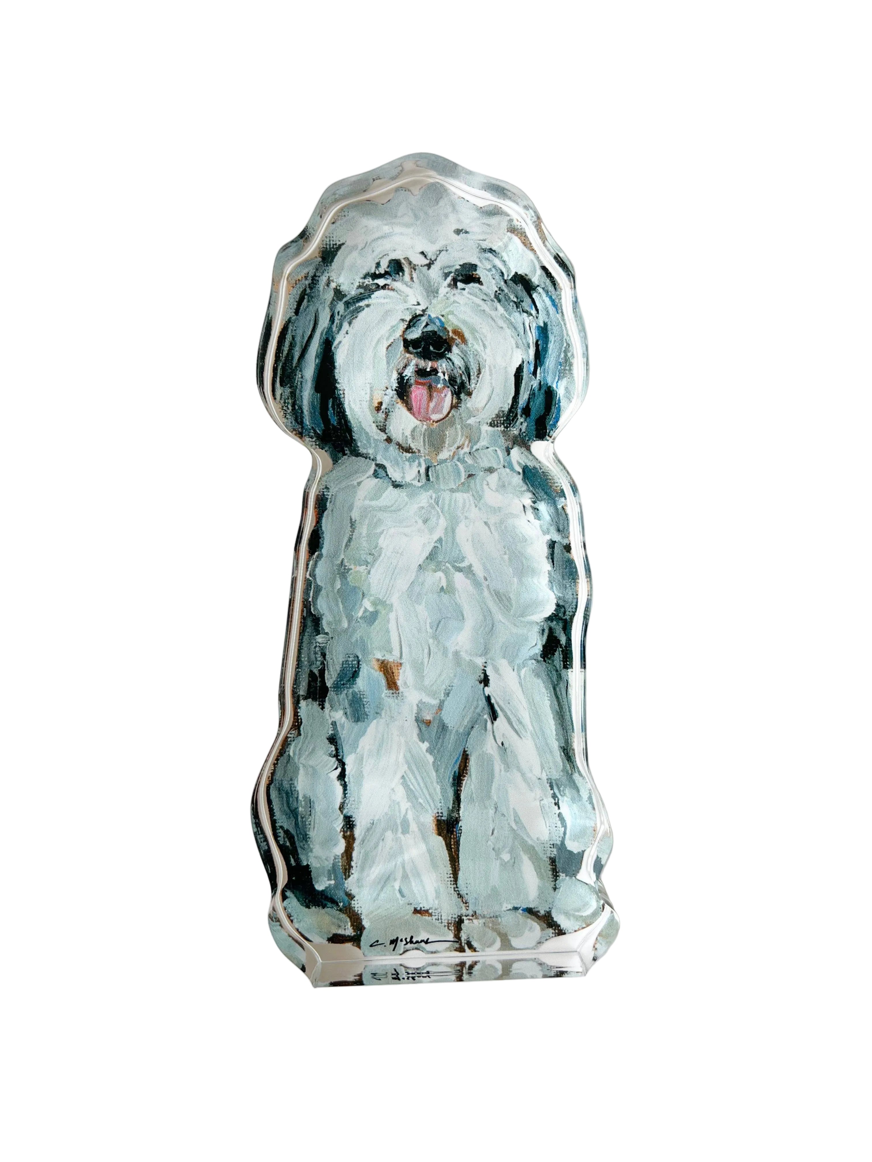 Decorative paperweight of a dog with a blue and white design on a light gray background