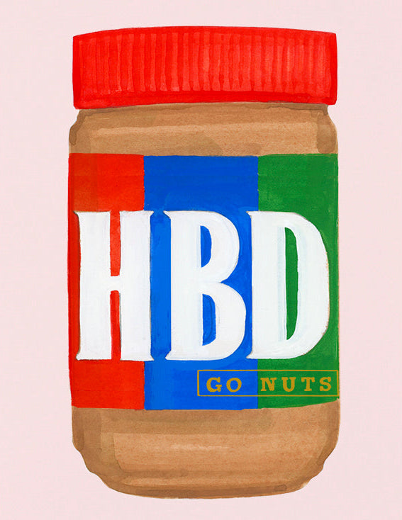 Jar of peanut butter with a colorful label on a pink background