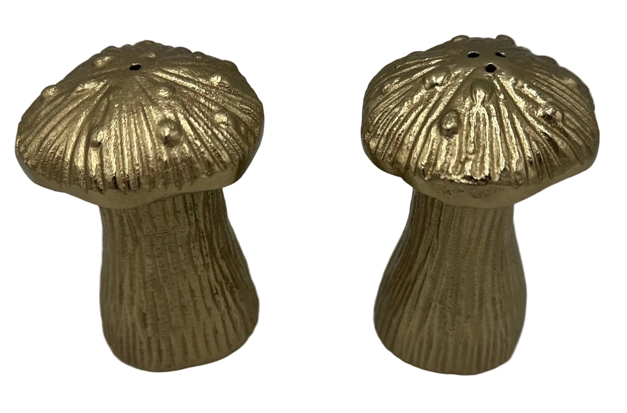 A pair of metallic gold mushroom-shaped salt and pepper shakers with textured ridges and small top holes, set against a neutral gray background.
