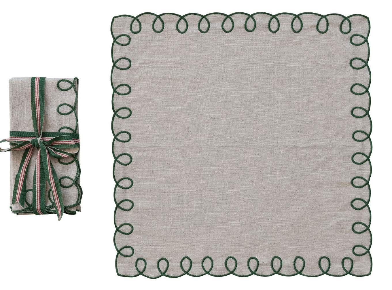 Set of folded fabric with decorative edge and a matching roll on a white background