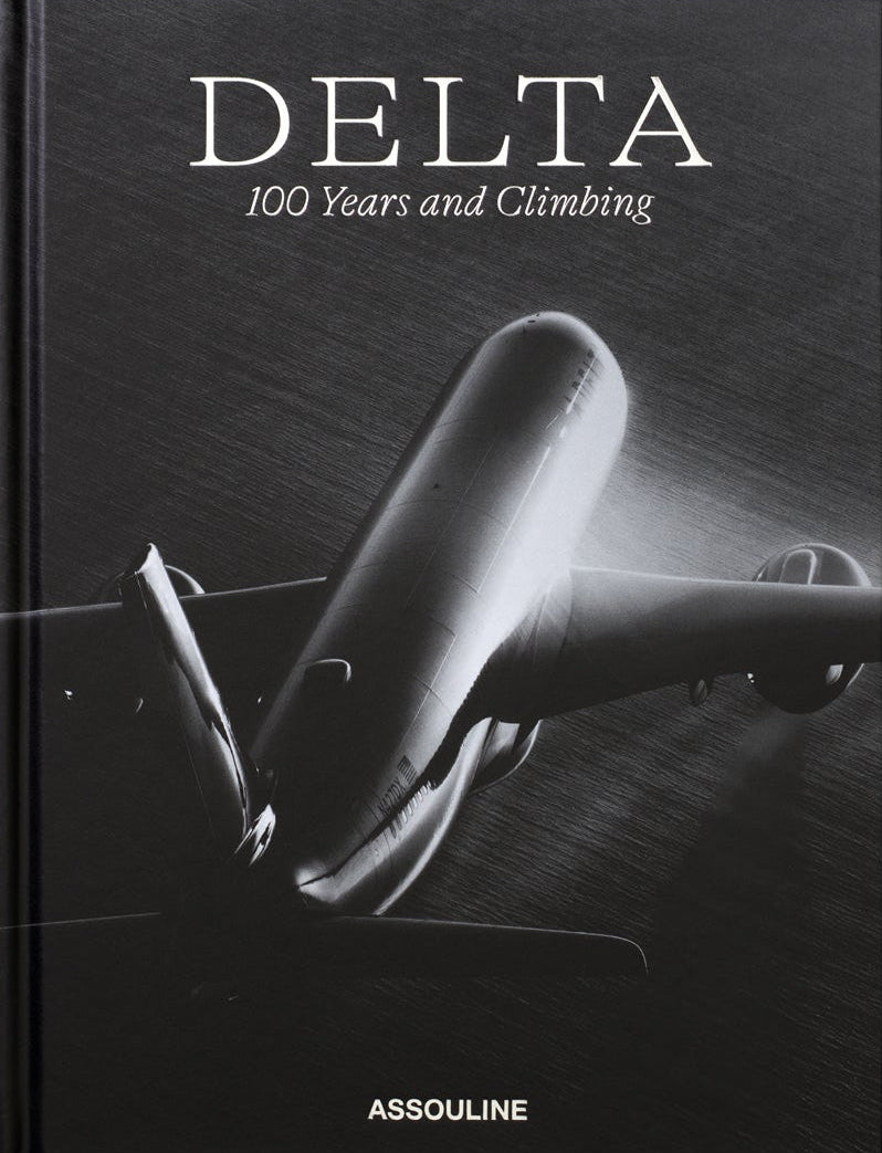 Book cover of 'Delta: 100 Years and Climbing' by Assouline with a black and white airplane illustration.