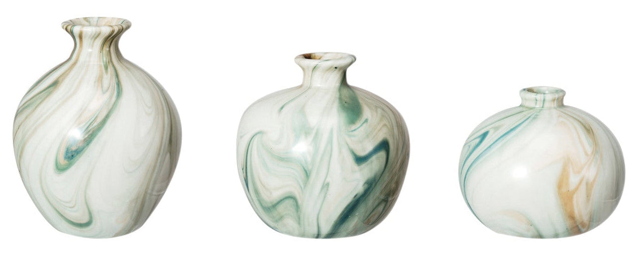 Three marbled ceramic vases on a white background