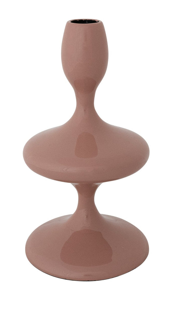 Pink ceramic vase with a unique design on a white background