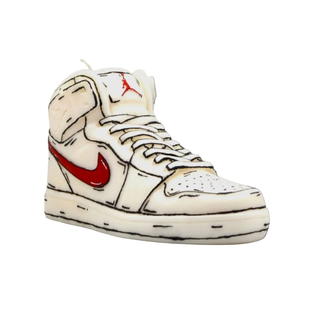 White sneaker candle with red Nike logo on a beige background