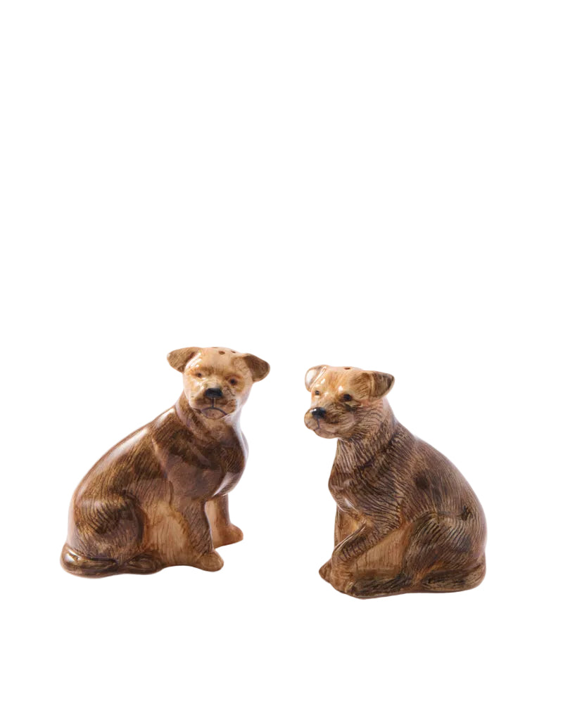 Two brown dog figurines sitting on a white background