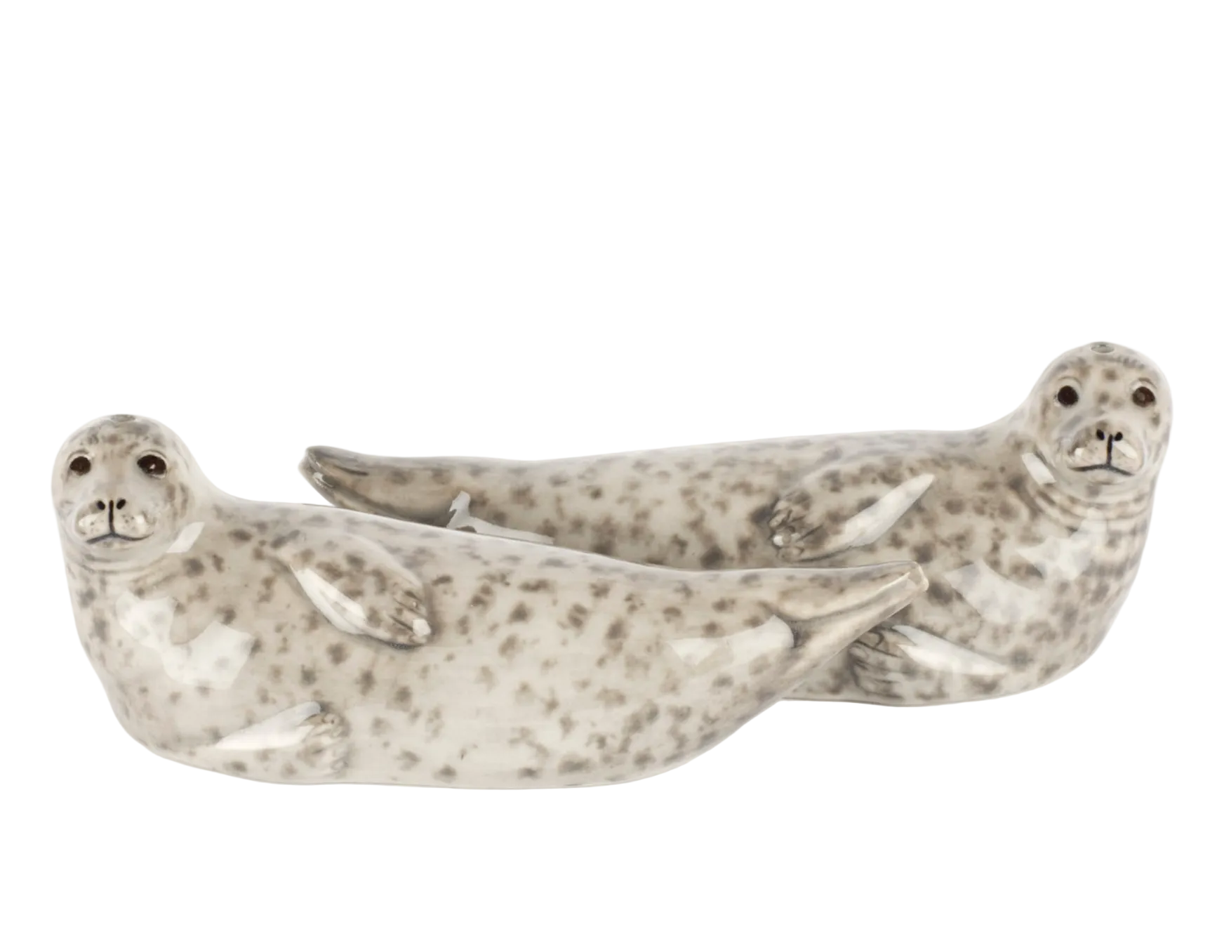 Two ceramic seal figurines on a white background
