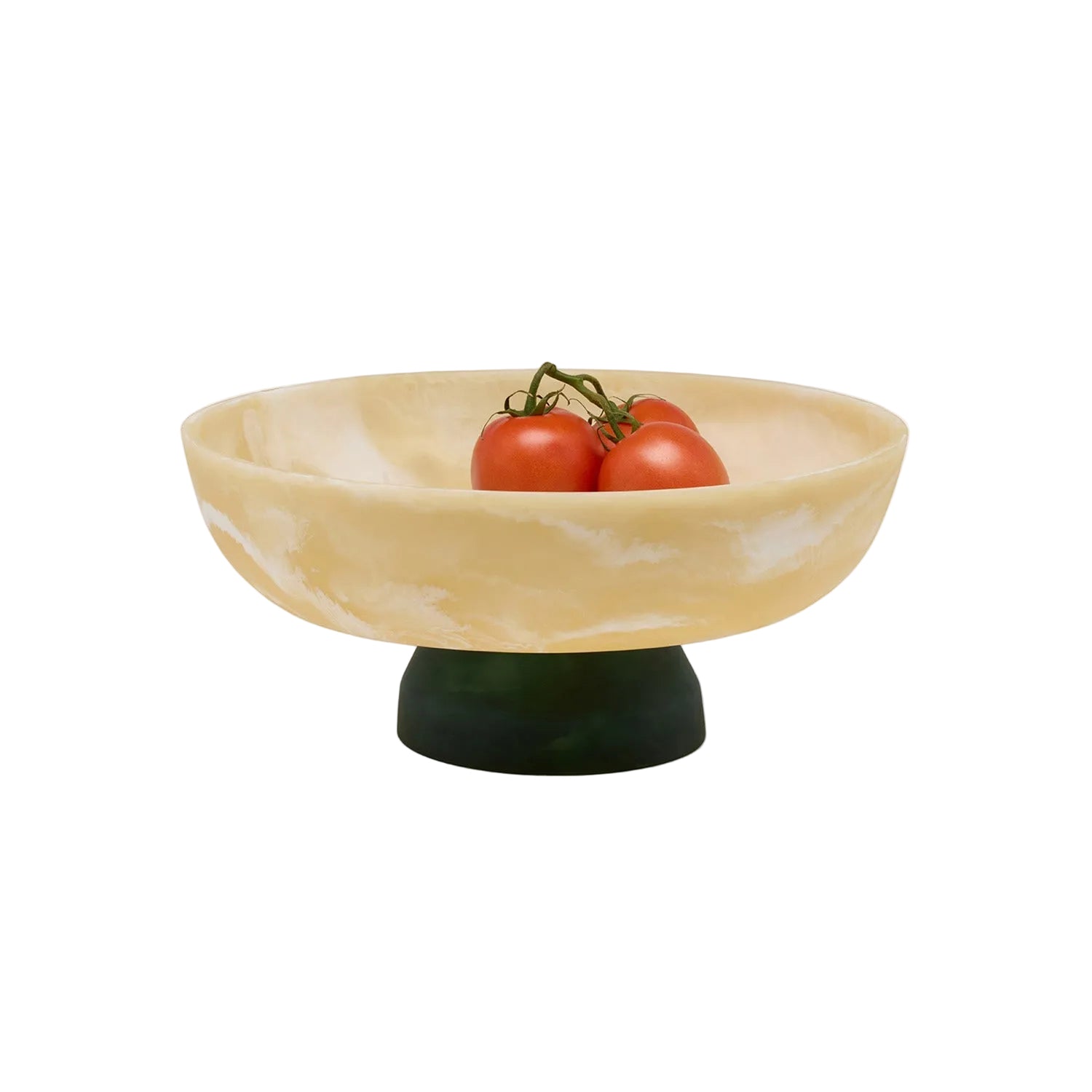 Decorative bowl with a green base holding three tomatoes on a white background