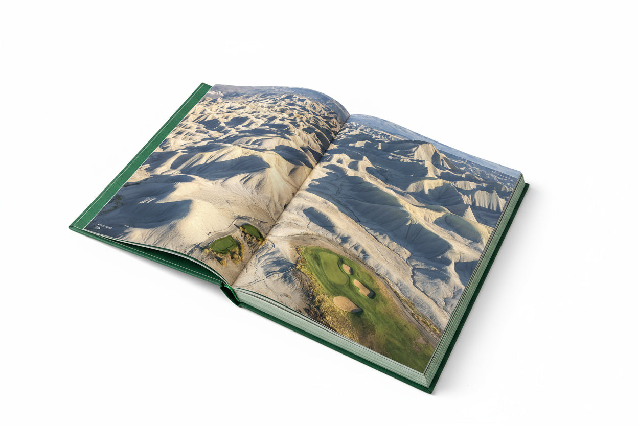 Open book displaying a golf course illustration on a white background