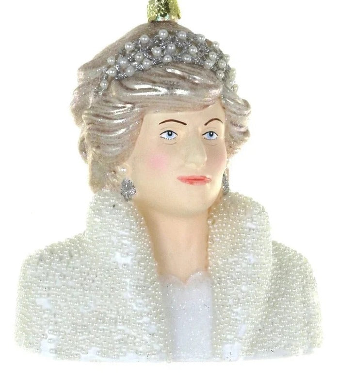 A decorative bust ornament of a woman with gray hair, a jeweled headpiece, and a white beaded coat, hanging against a plain white background.