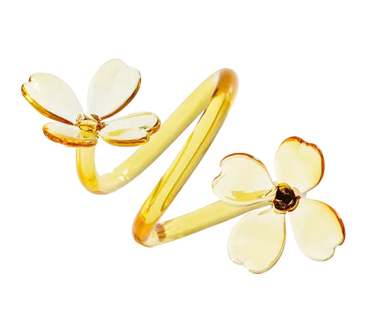 Gold flower-shaped earrings on a white background