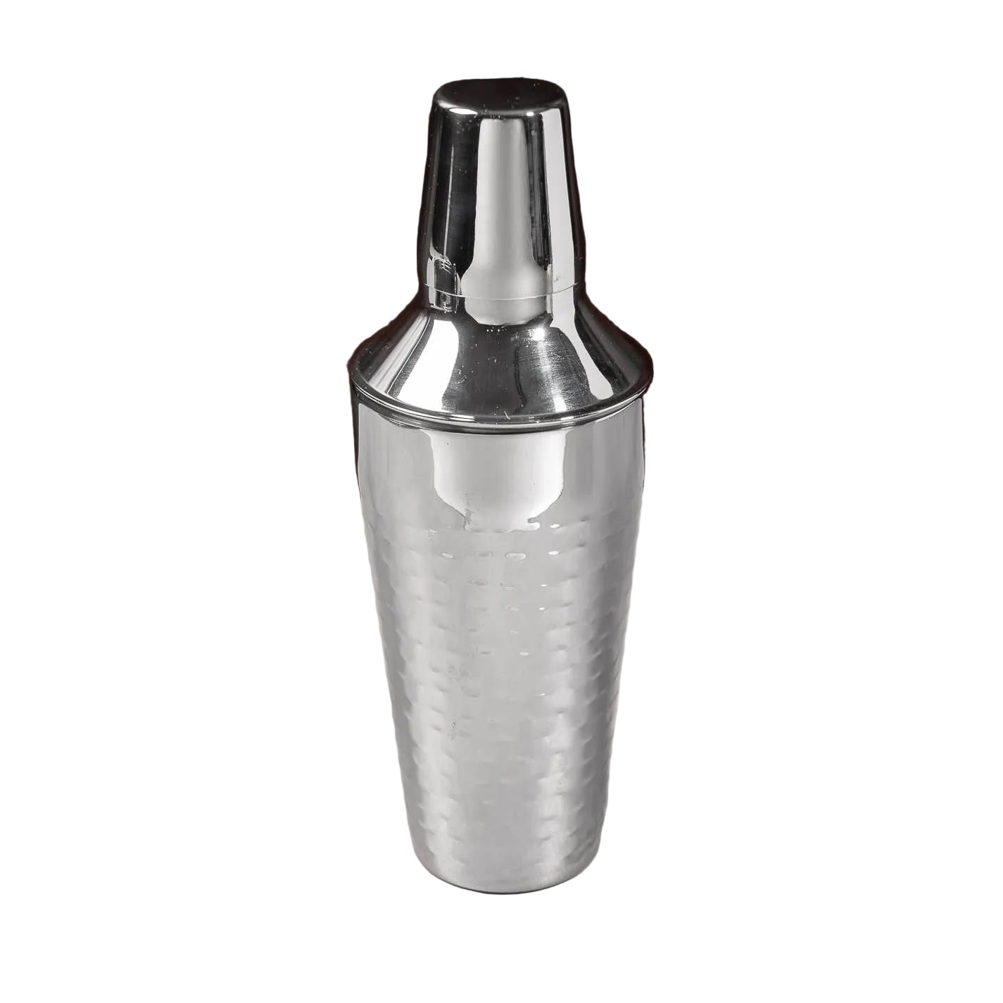 Silver cocktail shaker on a white surface with a dark background