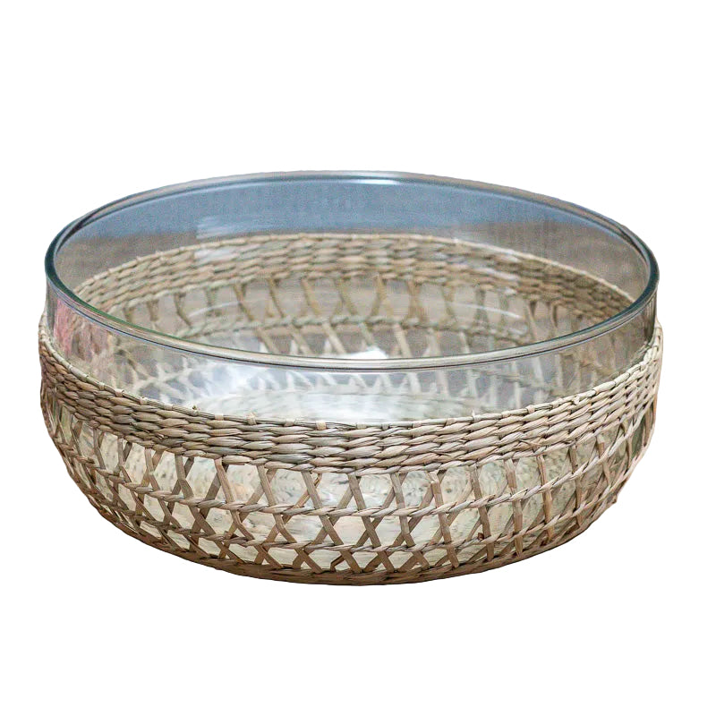 Glass bowl with woven rim on a wooden surface