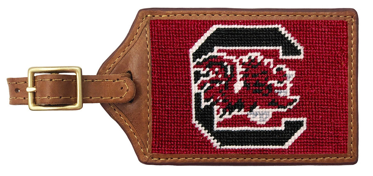 Luggage tag with a red background and logo on a white background