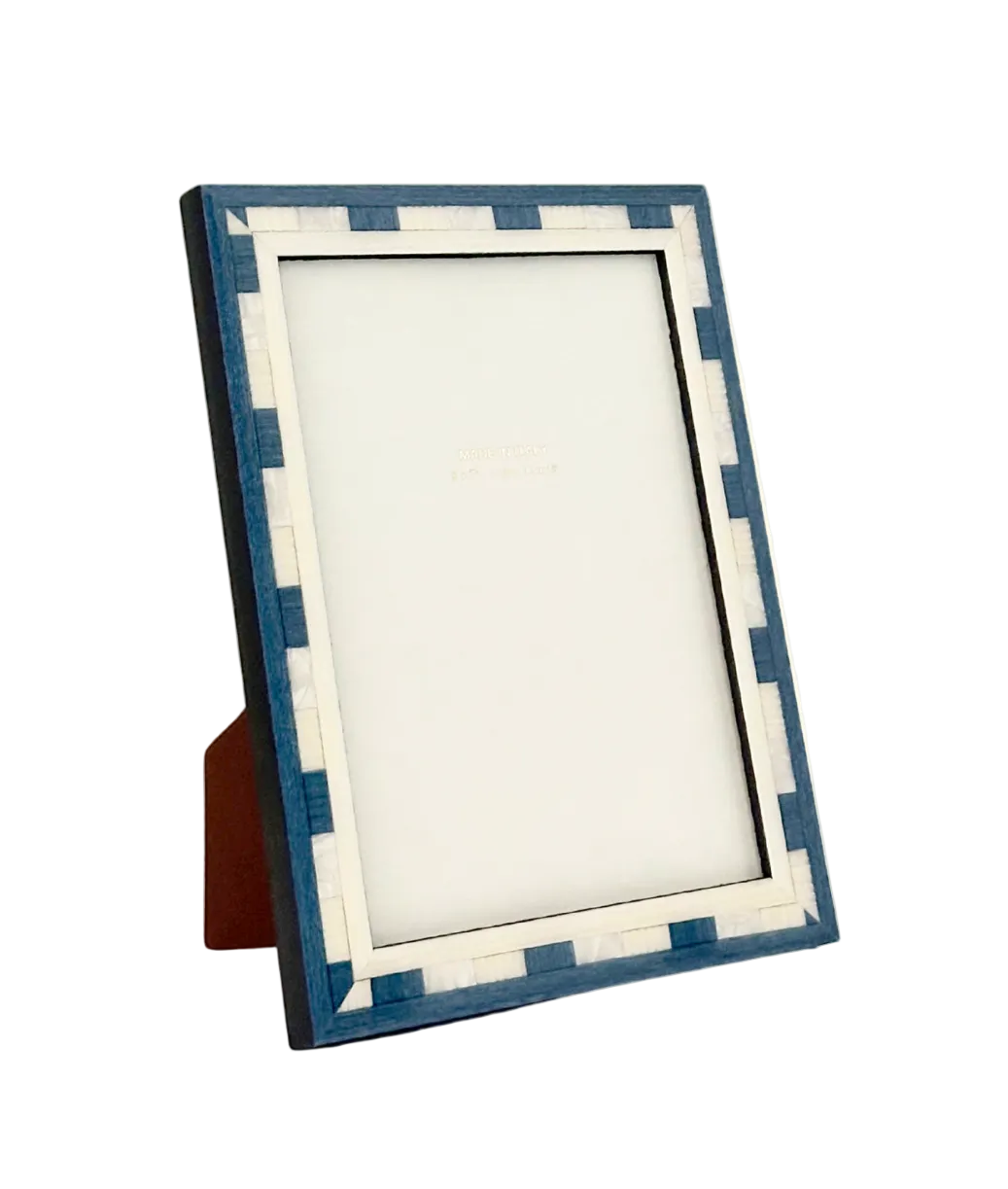Blue and white checkered picture frame on a white background