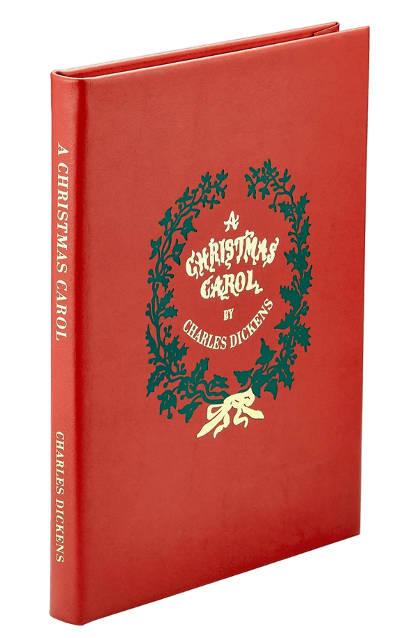 Red book cover of 'A Christmas Carol' by Charles Dickens with a green wreath design.