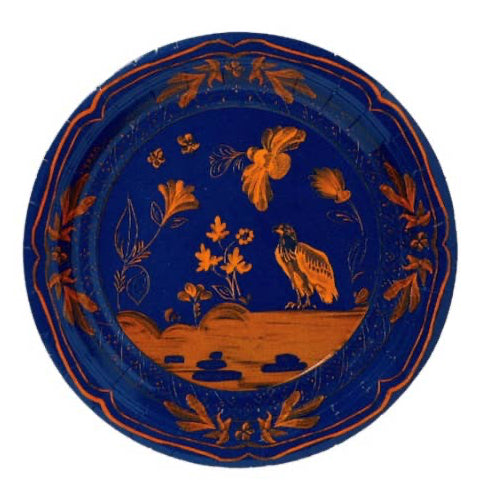A round ceramic plate with a deep cobalt blue glaze and hand-painted orange-brown floral and bird motifs, shown against a plain white background.