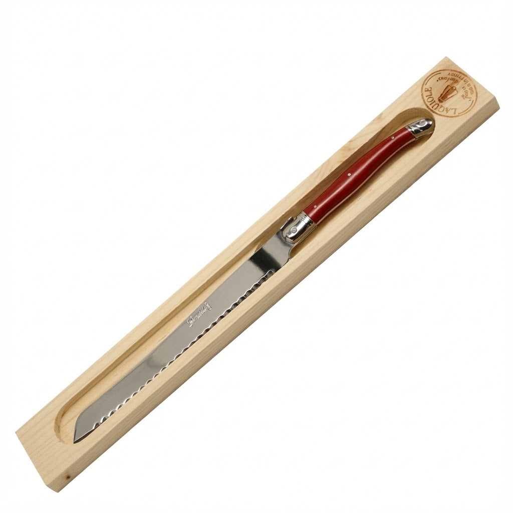 Knife with red handle in wooden box on white background
