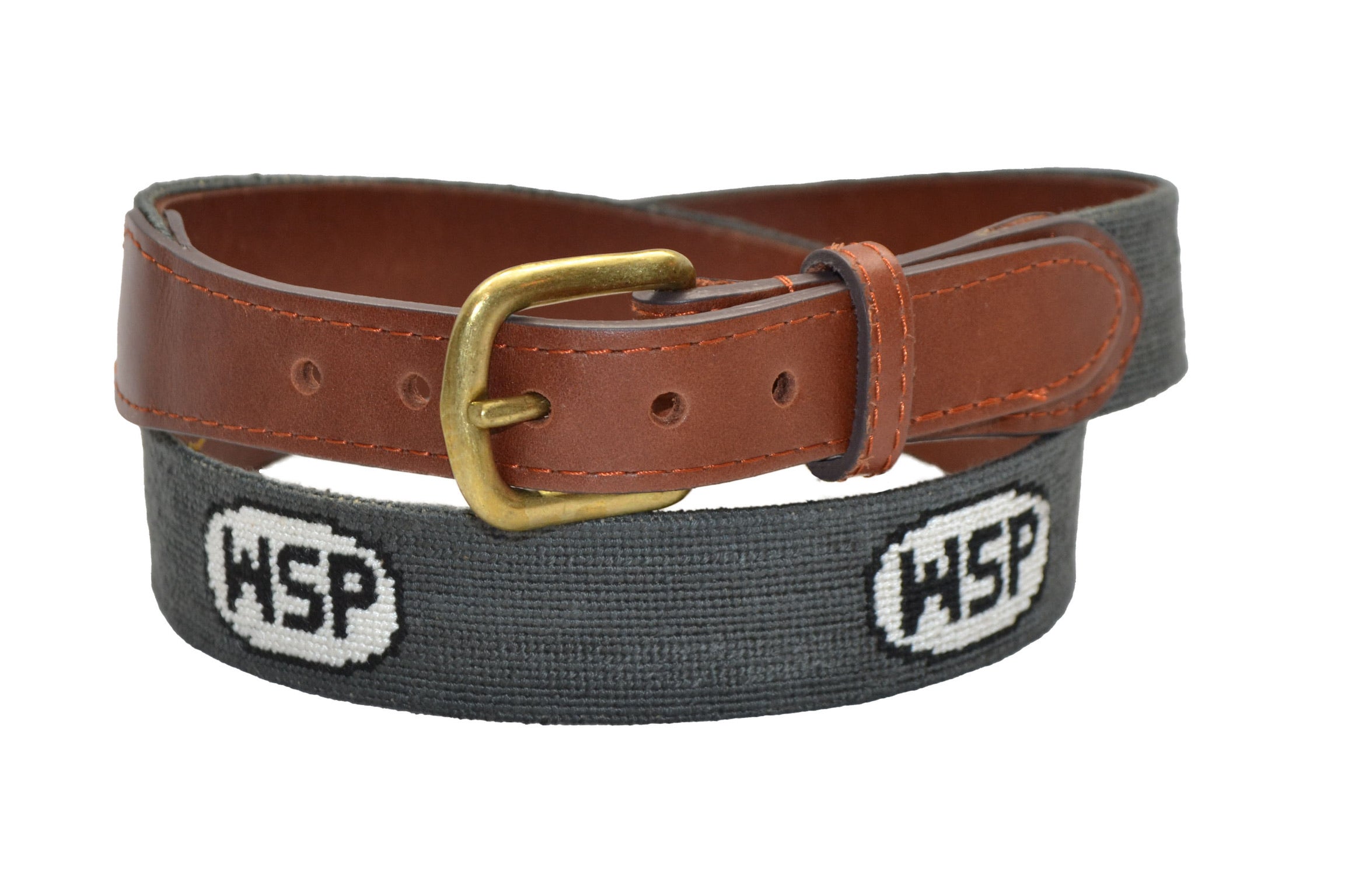 A needlepoint belt with a leather strap and metal buckle, featuring the initials 'WSP' on a gray background.