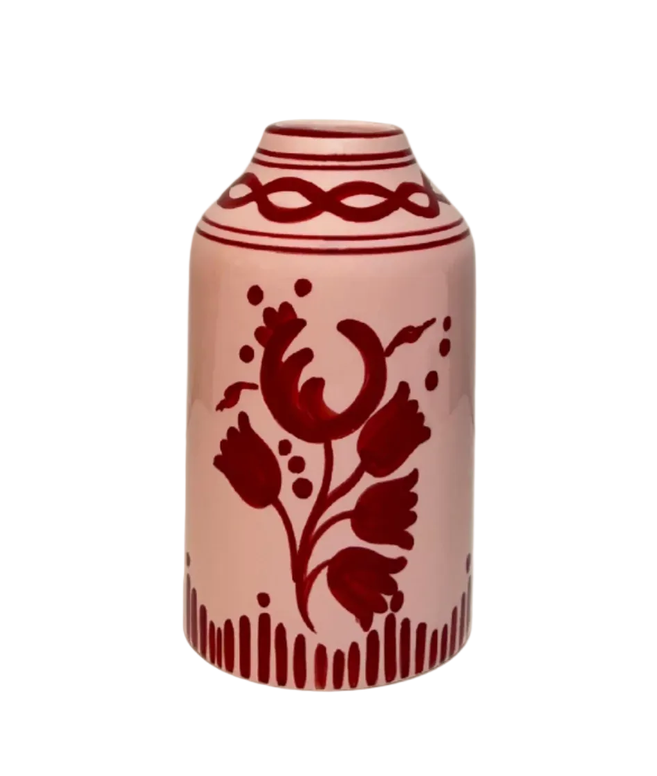 Decorative vase with red floral patterns on a white background
