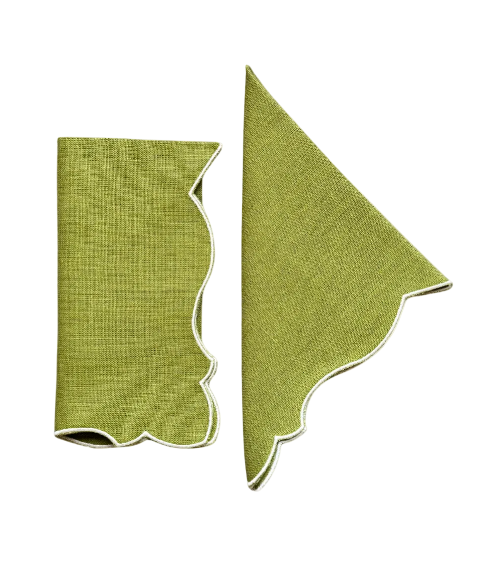 Two green fabric samples on a beige background