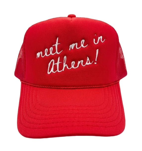 Red cap with 'meet me in Athens!' text on a white background