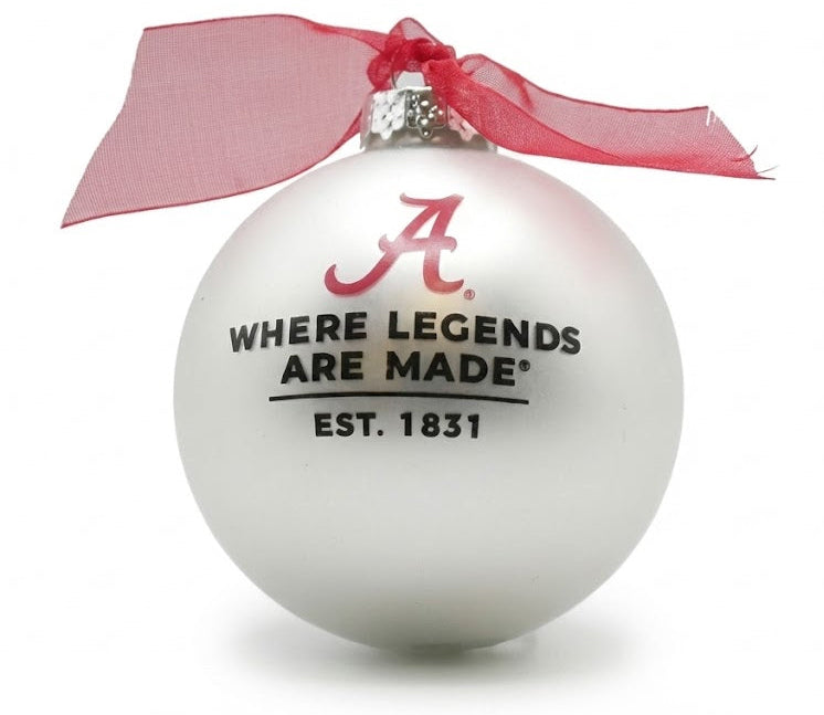White ornament with red ribbon and text on a white background