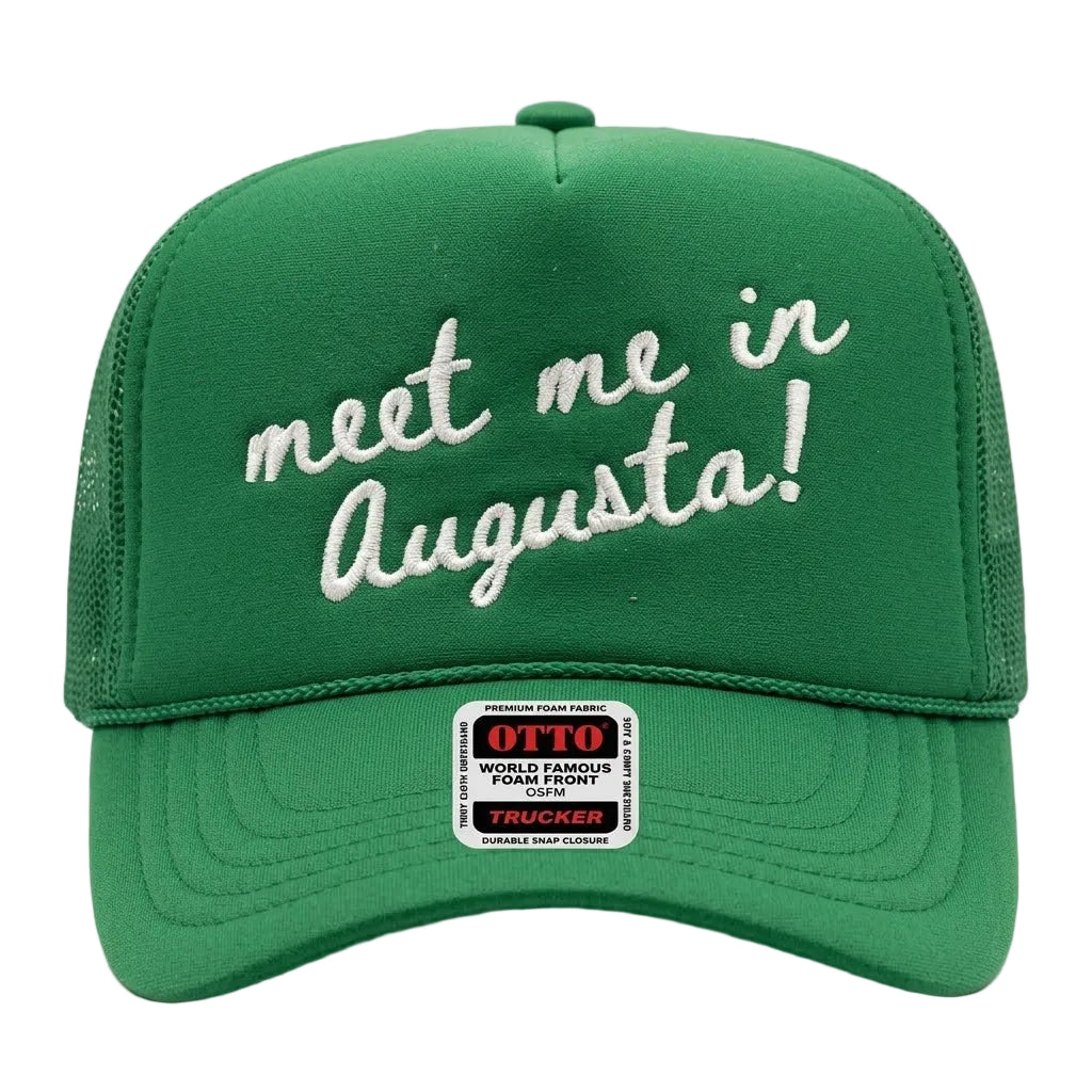 Green embroidered hat with 'meet me in Augusta!' text on a white background