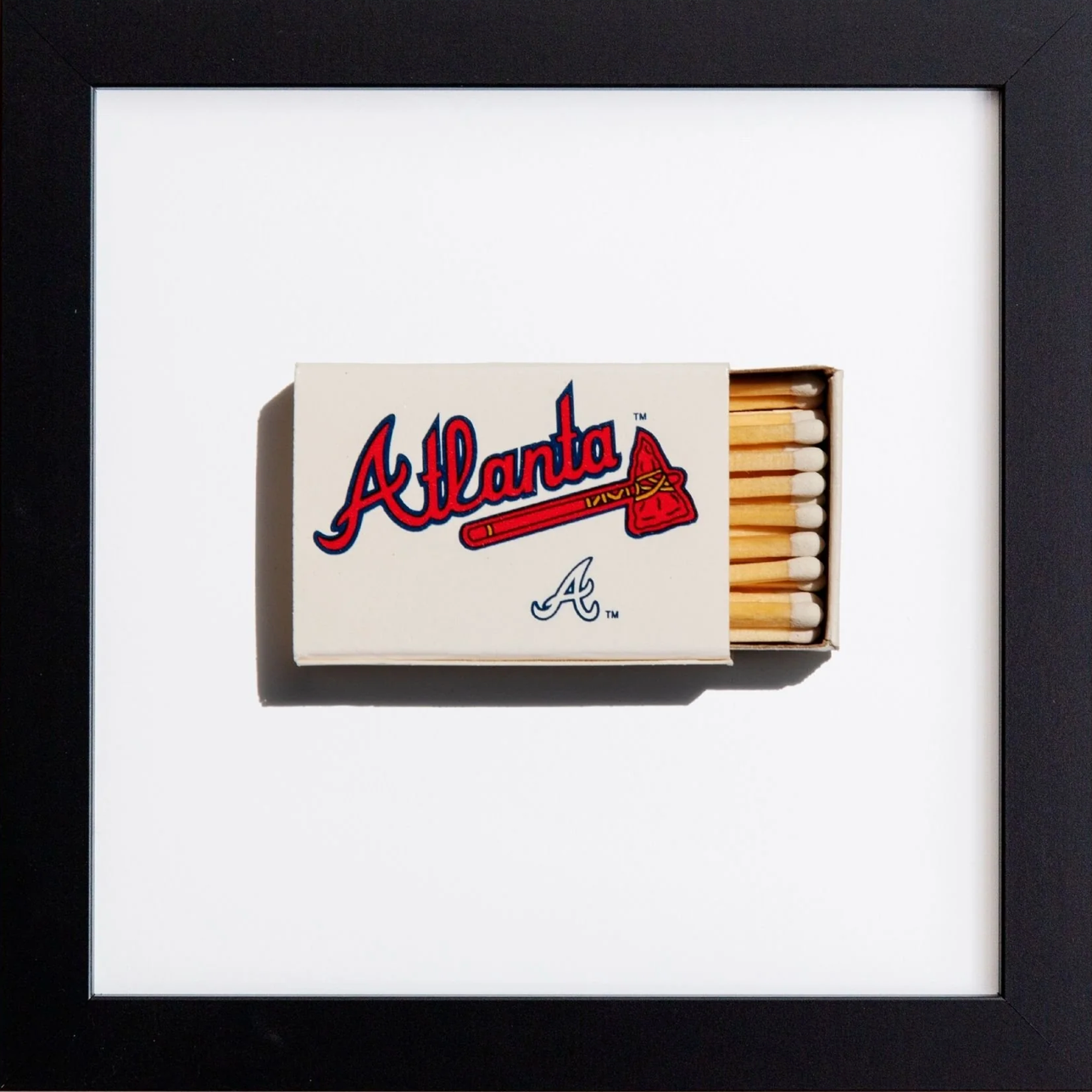 Matchbox with Atlanta logo in a black frame