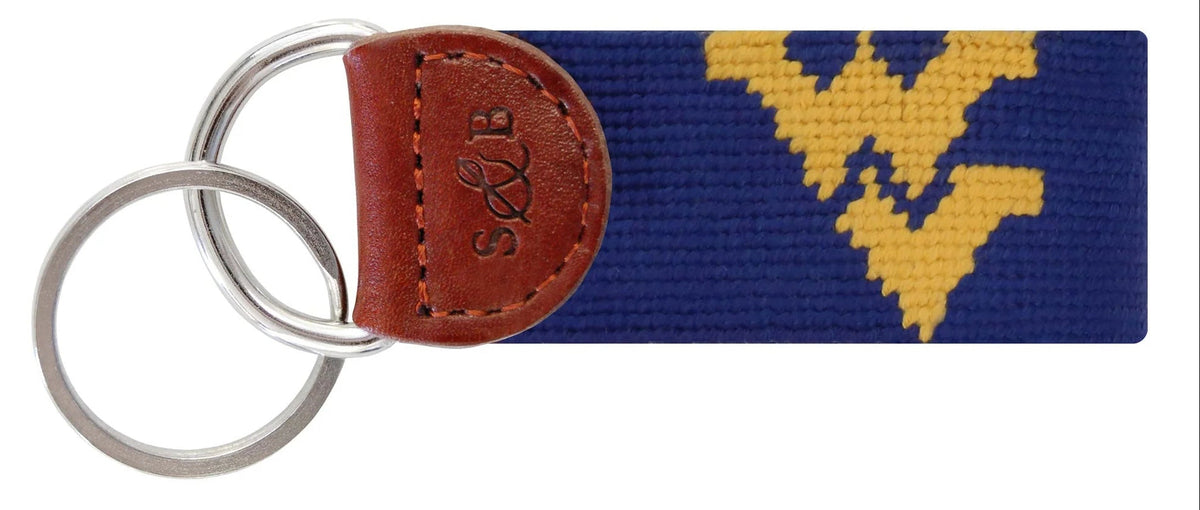 Keychain with brown leather tag and yellow logo on blue background