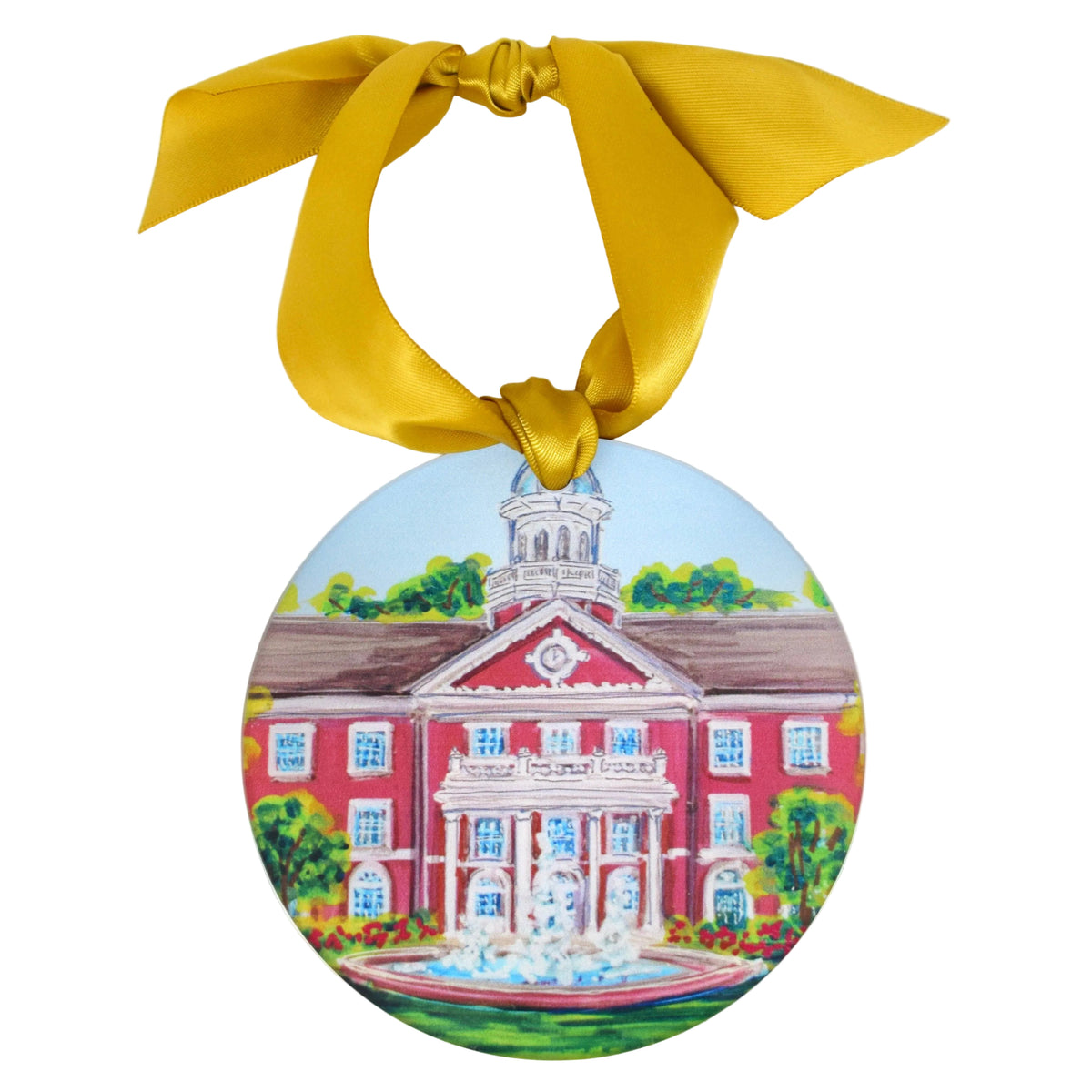 A round ceramic ornament featuring a painted illustration of a red brick capitol building with a fountain, hanging from a wide gold ribbon bow against a plain white background.