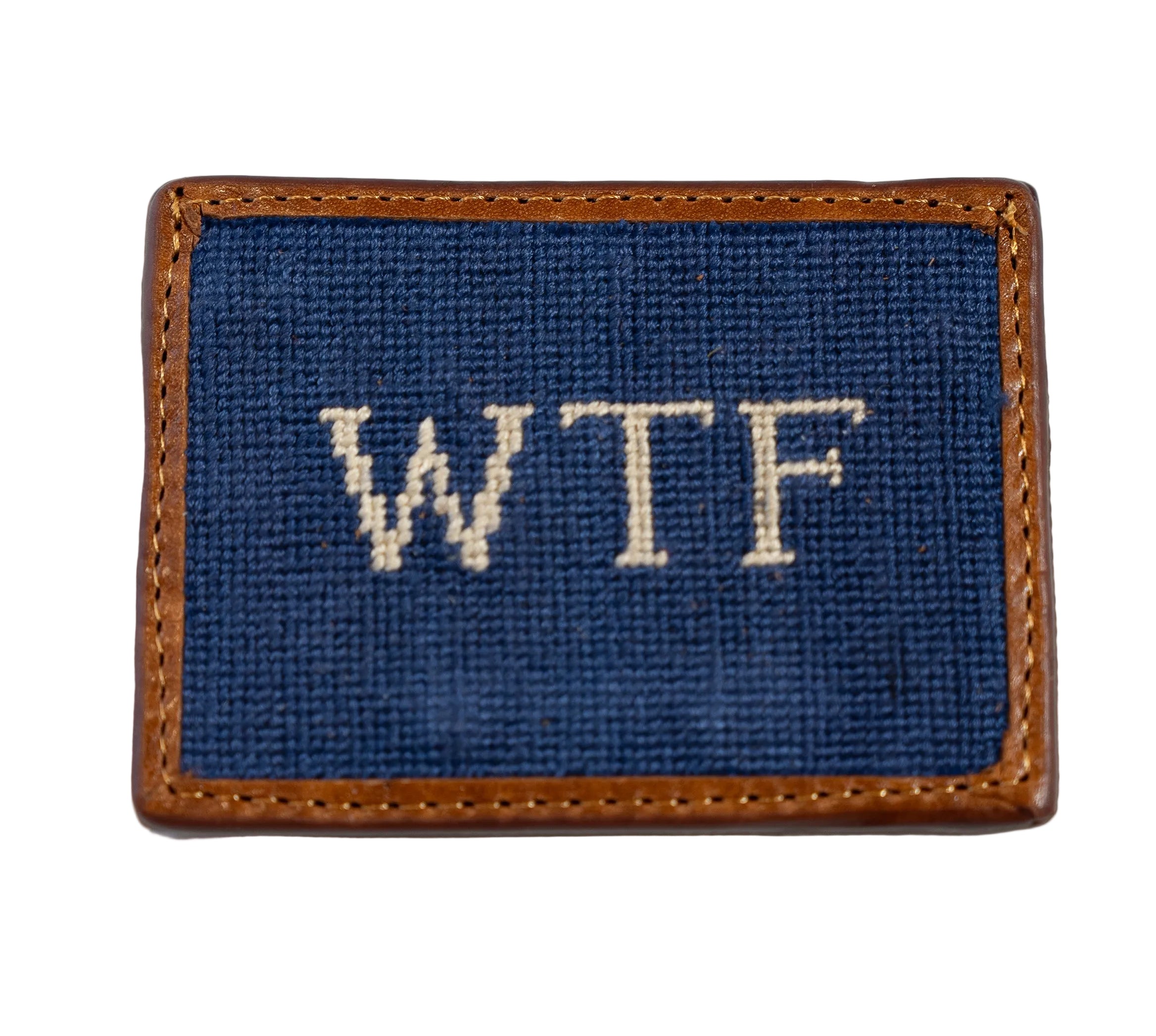 A blue needlepoint credit card wallet with the text 'WTF' stitched in white, surrounded by a brown leather border.