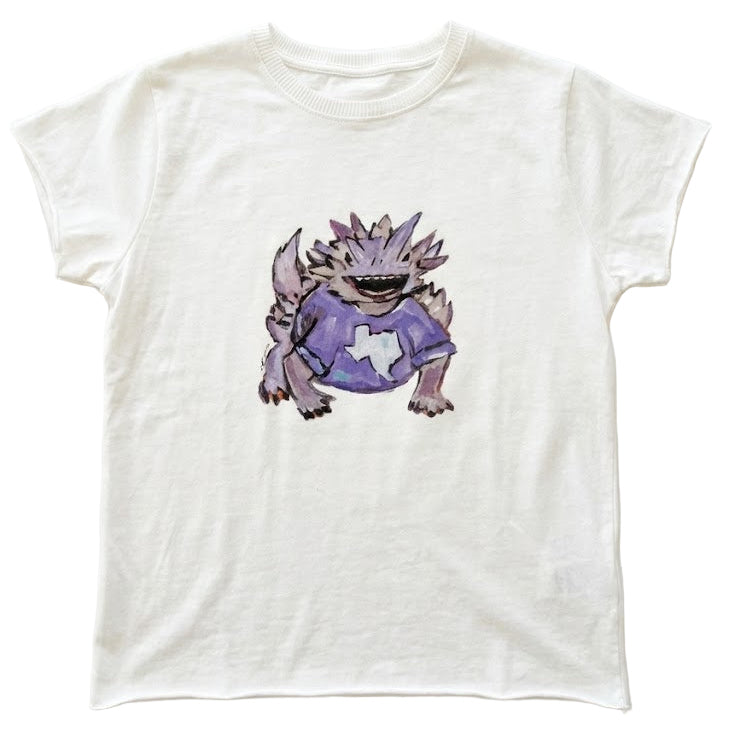 White t-shirt with a purple horned frog drawing on a white background