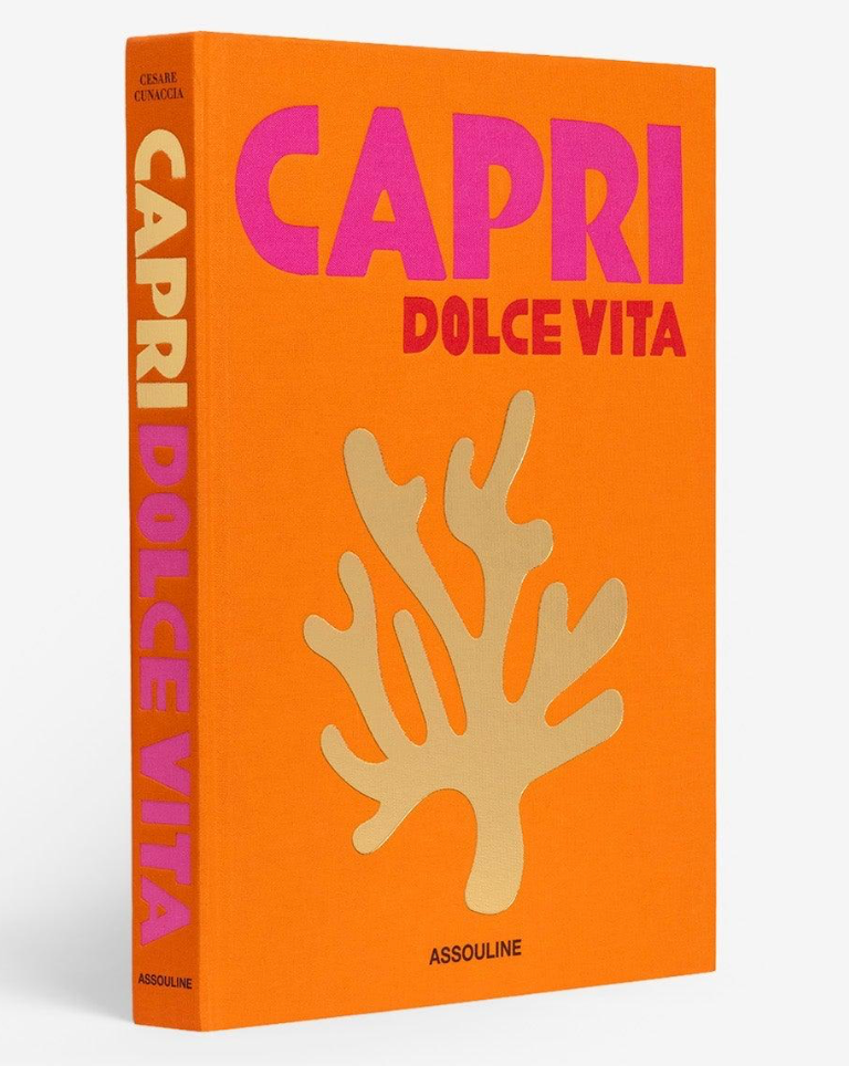 Book titled 'Capri Dolce Vita' with orange cover and coral design on a white background
