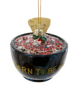 A glass ceiling fan accessory with red and green embellishments and text that reads 'BORN TO BE MILD'.