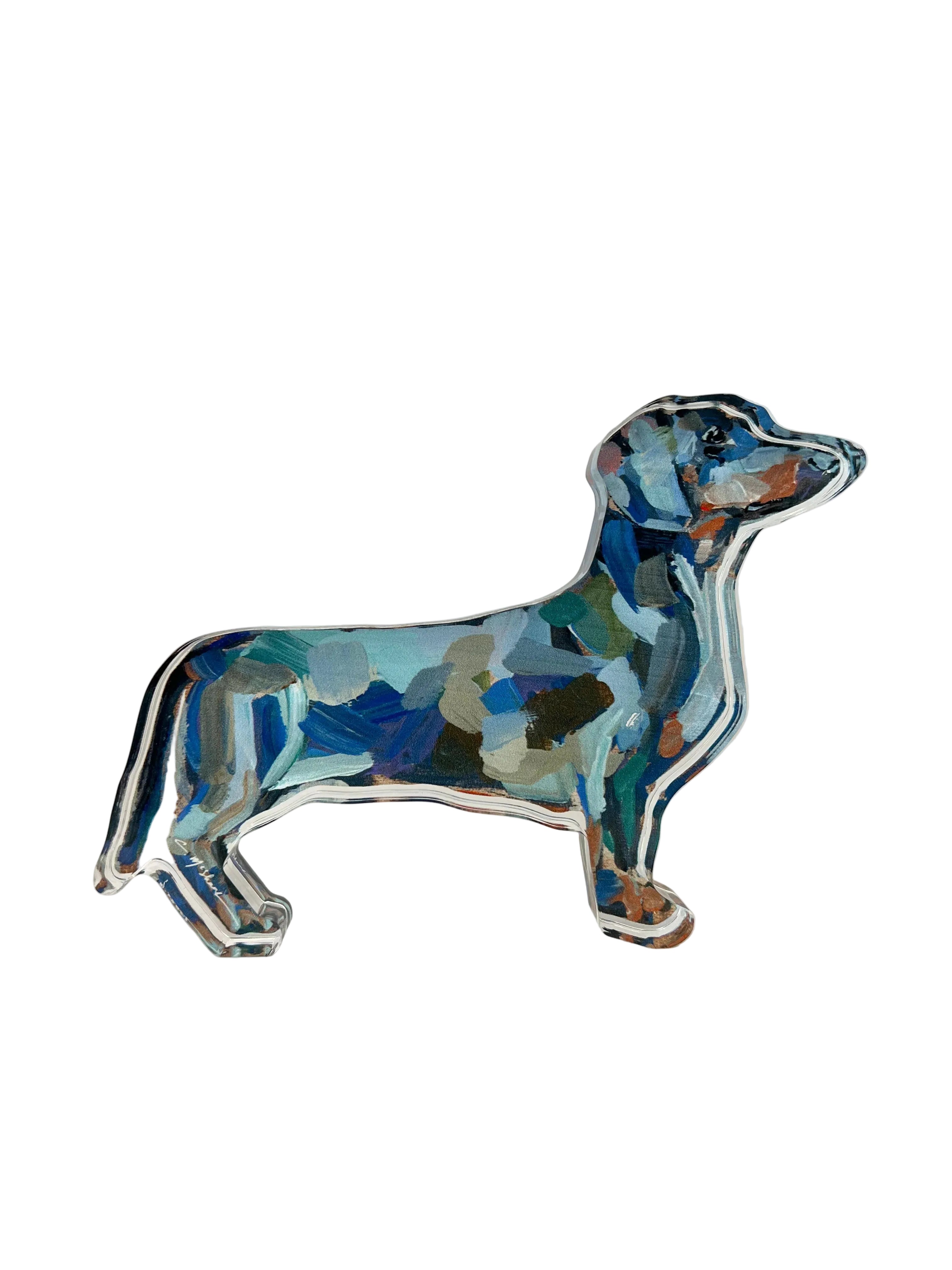 A sculpture of a dachshund made with abstract colorful patterns on a white background
