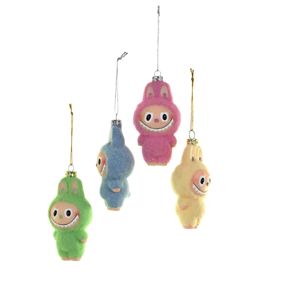 Four colorful plush toys hanging from strings on a white background inspired by Labubu