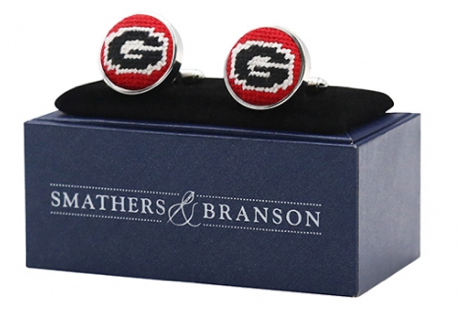 Pair of cufflinks with a logo on a Smathers & Branson branded box.