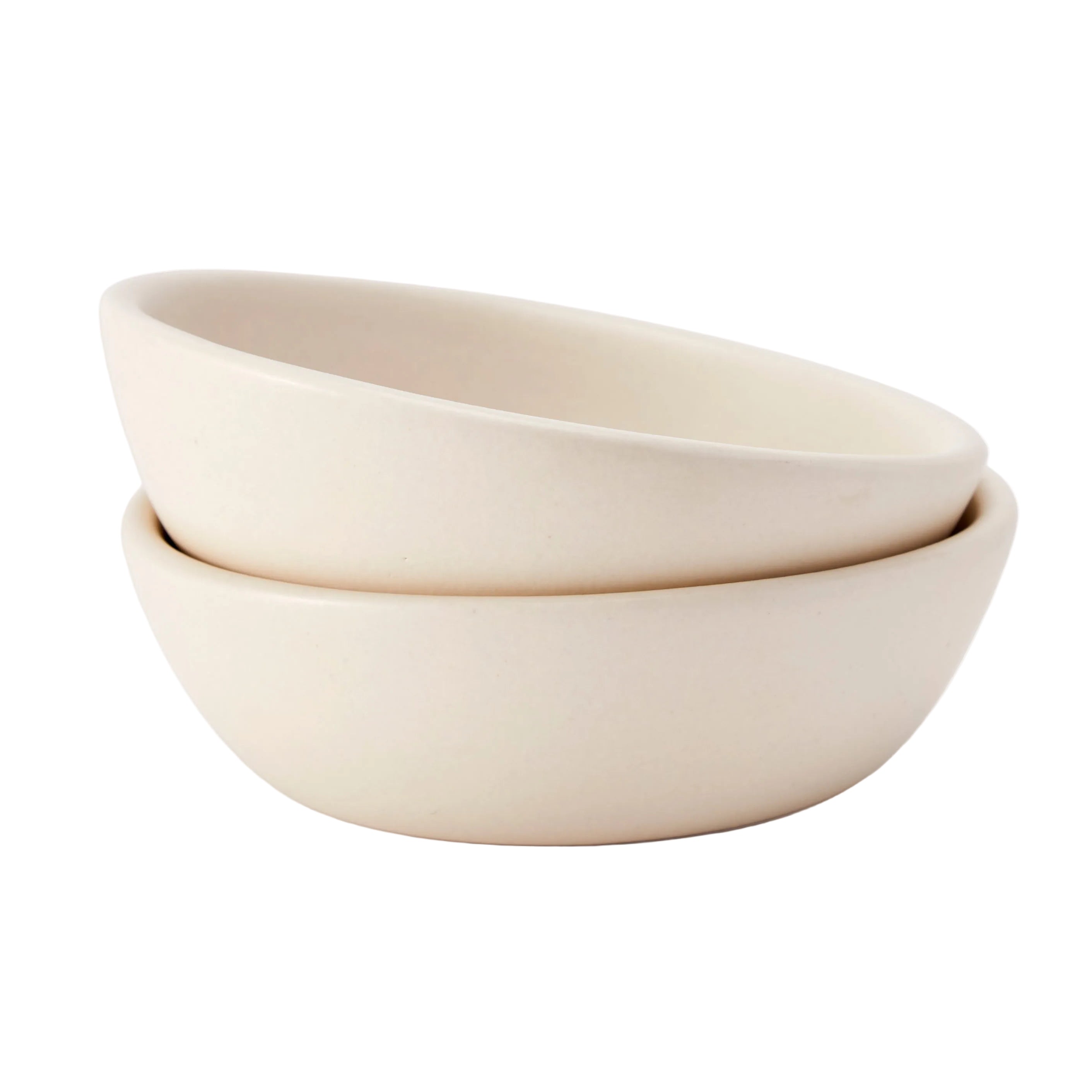 Two beige ceramic bowls stacked on a white background