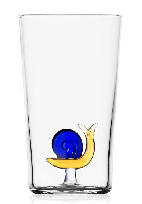 A clear glass pint glass featuring a small snail design near the base, with a yellow body and a blue spiral shell, set against a plain white background.