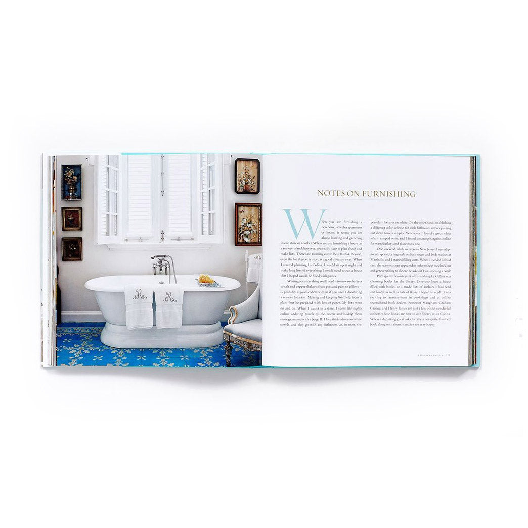 Open book showing a bathroom scene with a freestanding bathtub.