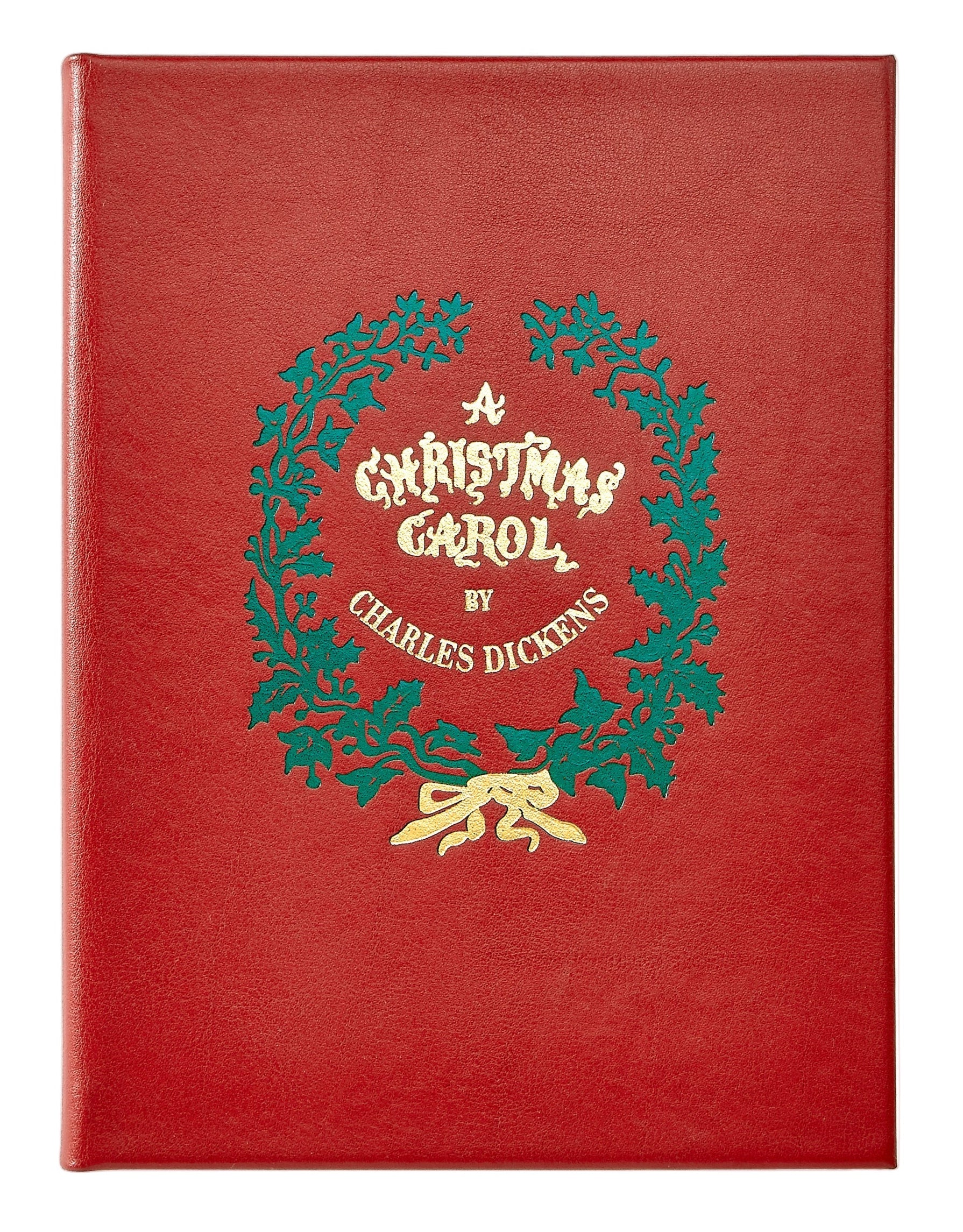 Red leather book cover with a Christmas Carol design featuring holly and a bow on a white background
